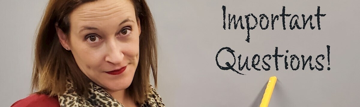 A woman with light brown hair and red lipstick points a yellow stick at a board displaying the words "Important Questions!.