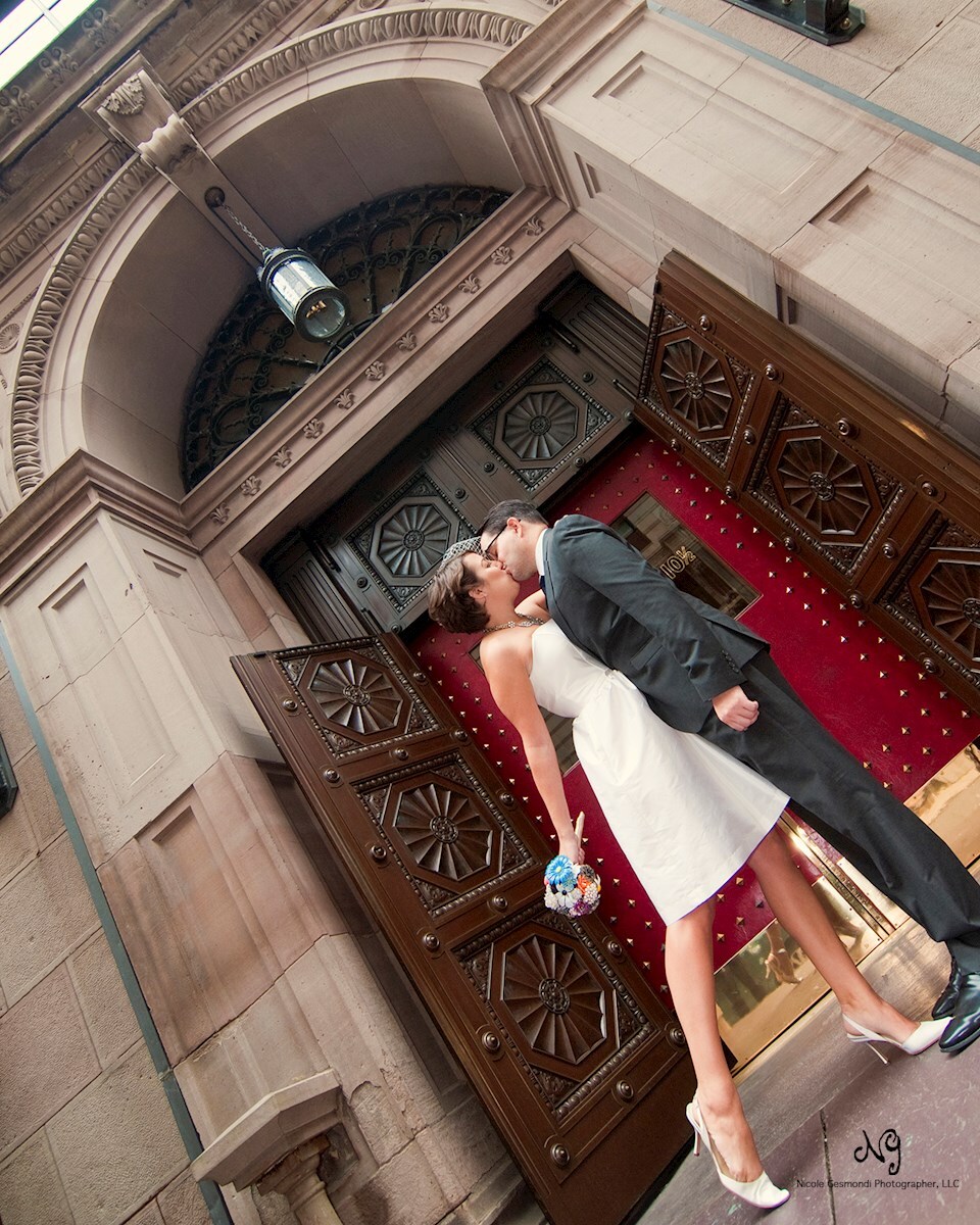 Bride and Groom in front of red doors at Boston Athenaeum Bride and Groom in front of red doors at Boston Athenaeum