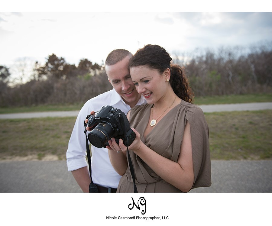Engagement couple viewing their photos