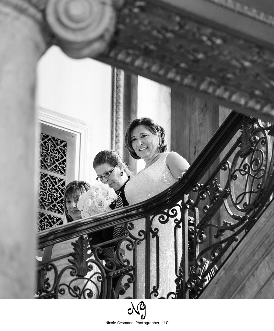 Bride walking down indoor staircase at Providence Public Library
